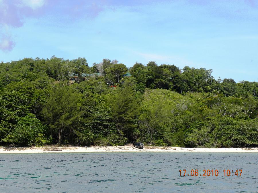 View from sea showing boat slipway & Lodge on hilltop